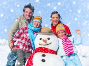 Family in winter time with snowman