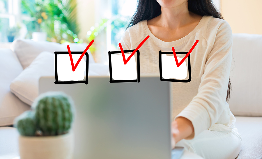 woman making checklist to avoid home buyer's remorse