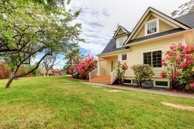 summery home with flowers