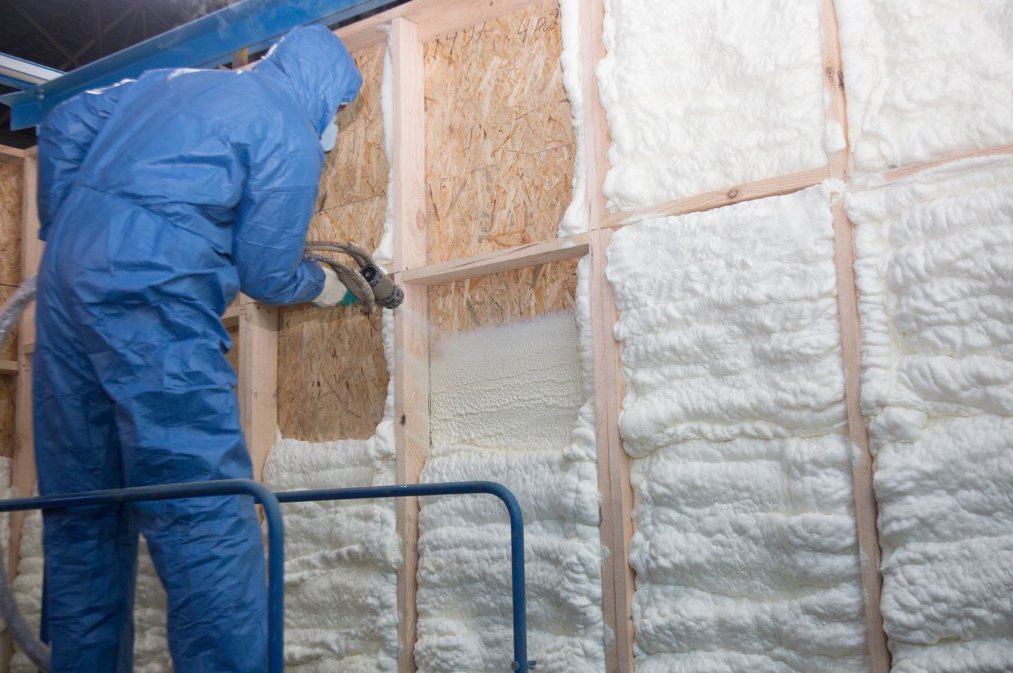 man spraying spray foam